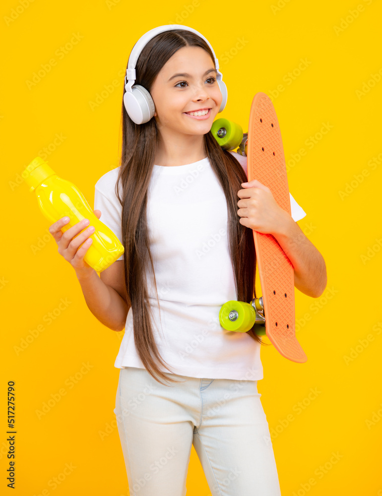 Teenagers lifestyle, casual youth culture. Teen girl with skateboard over isolated studio background. Cool modern teenager in stylish clothes. Happy teenager portrait. Smiling girl. Teenagers lifestyle, casual youth culture. Teen girl with skateboard over isolated studio background. Cool modern teenager in stylish clothes. Happy teenager portrait. Smiling girl.