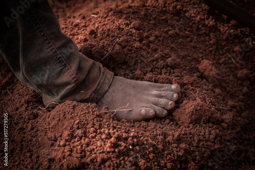 A black man's foot on the earth photo