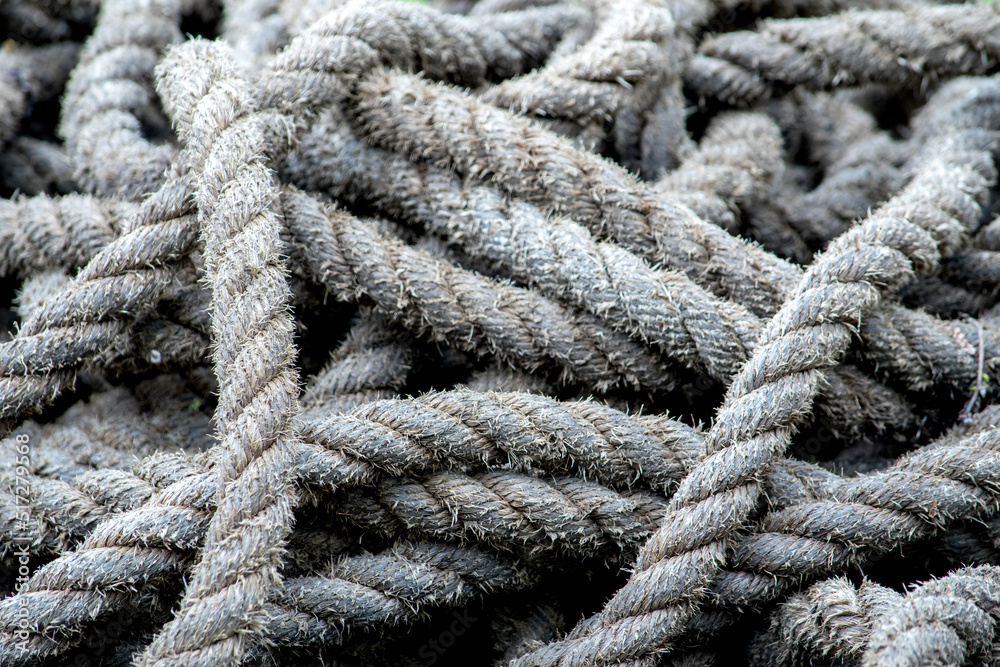 Old rustic rope lies in a pile outdoors