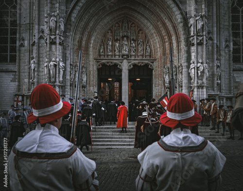 A cinematic capture from traditional Ommegang ceremonies in front of the Church of Lady of the Sablon in Brussels, Belgium on 26 June 2022. photo