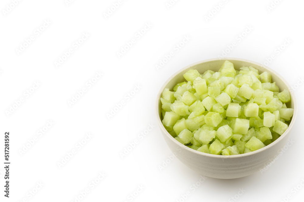 Chayote cubes in bowl isolated on white background. Chayote cubes in bowl isolated on white background.
