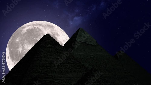 Moon rising over the Giza pyramid complex. Full moon and starry sky. Photo realistic 3D render. [ProRes - UHD 4K]