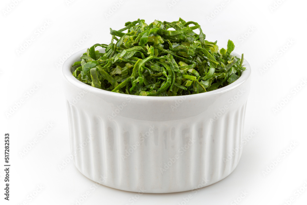 Kale sliced in ramekin isolated on white background. Kale sliced in ramekin isolated on white background.