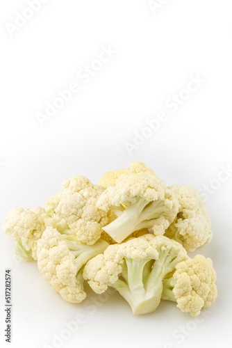 Cauliflower pieces isolated on white background. photo