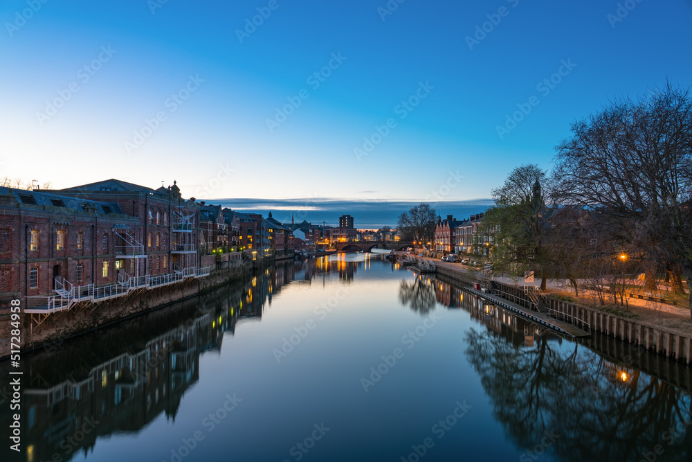 The city of York in England with Ouse river canal at sunset