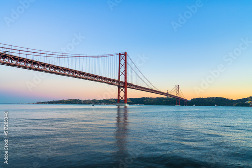 The 25 de Abril bridge at sunset over the Tajo River in Lisbon. Portugal © Pawel Pajor