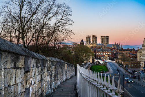 The city of York in England with its medieval wall and the York Minster at sunset photo