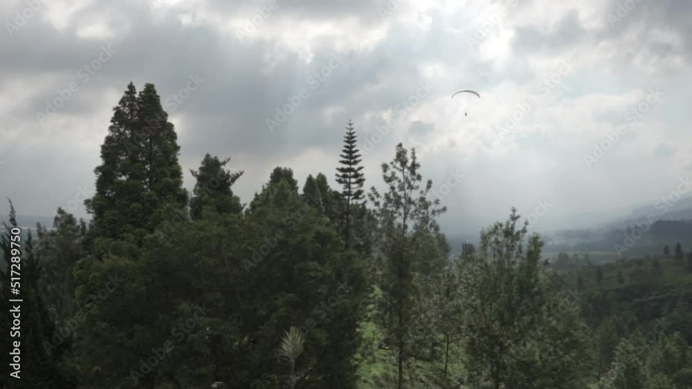 Paragliding Recreational Competitive Adventure Sport of Flying Paragliders from Hilltop in Puncak Cisarua Bogor, Indonesia Paragliding Recreational Competitive Adventure Sport of Flying Paragliders from Hilltop in Puncak Cisarua Bogor, Indonesia