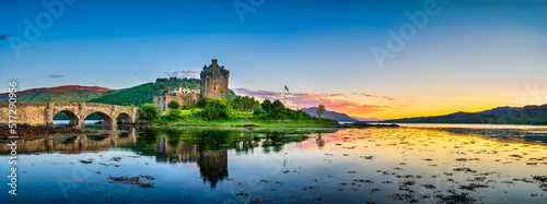 Eilean Donan Castle at sunset in Scotland.