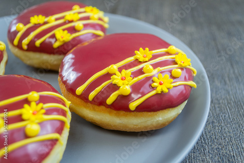 red velvet donuts or donat red velvet, the taste is sweet and savory combined with red velvet glaze that melts in the mouth photo