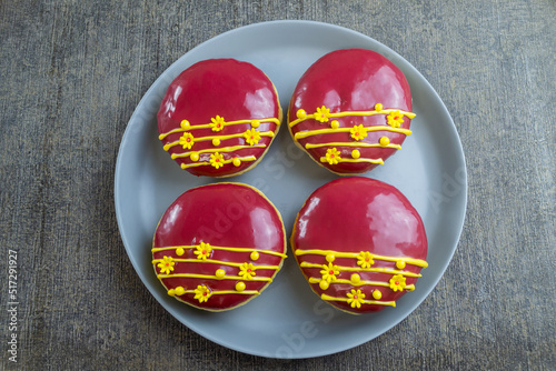 red velvet donuts or donat red velvet, the taste is sweet and savory combined with red velvet glaze that melts in the mouth. top view, flat lay photo