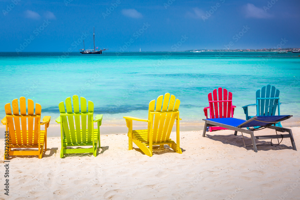 Colorful chairs and Caribbean beach with pirate ship, Aruba