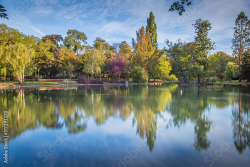 Reflection Lake in Stadtpark, Vienna, at peaceful sunrise, Austria