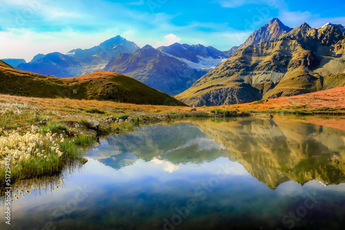 Fototapeta Naklejka Na Ścianę i Meble -  Autumn alpine landscape with lake reflection in Zermatt, Switzerland
