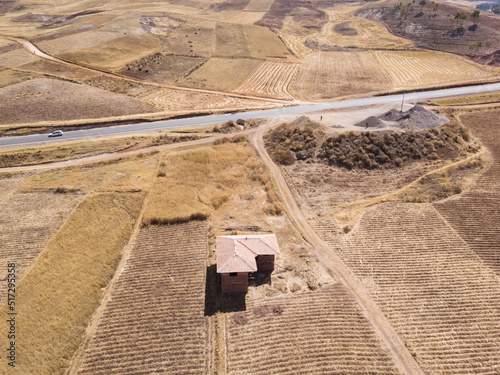 Aerial view of highway in Peruvian Andes. Rural scene during dry season in Cusco Peru.