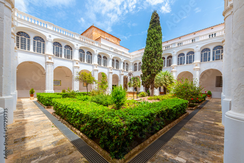 The picturesque inner courtyard of the cloisters of the Convent de Sant Agust   and and Esgl  sia dels Socors in the historic center of the Old Town.