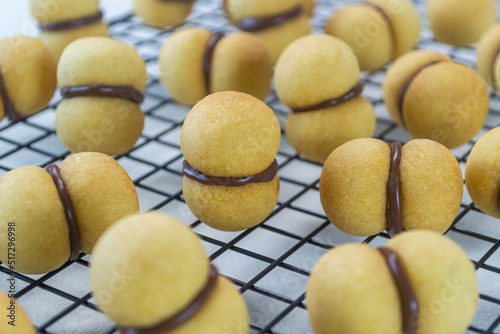 Baci di Dama (Italian Hazelnut Cookies). Baci di dama are a sandwich cookie, consisting of two hazelnut cookies joined together by chocolate