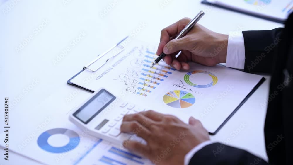 Business accounting concept, Business man using calculator with computer laptop, budget and loan paper in office. Business accounting concept, Business man using calculator with computer laptop, budget and loan paper in office.