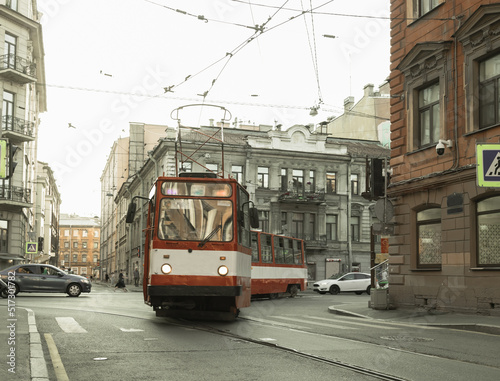 The old tram turns on the narrow streets of the city..