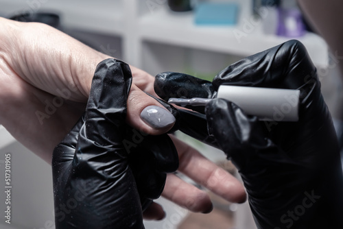 The process of manicure in a beauty salon close-up