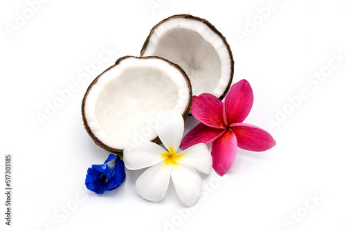 Half coconut and plumeria on white background.