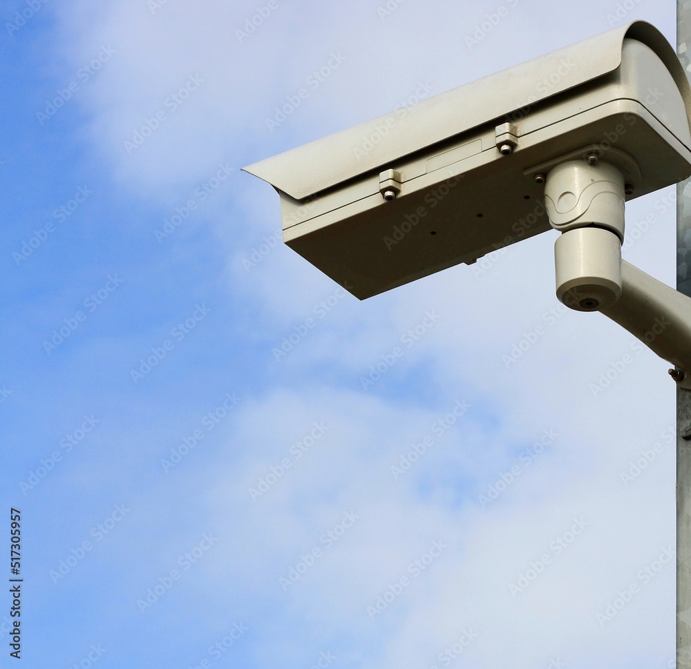 security camera on a metal pole looking out for crime no people stock photo security camera on a metal pole looking out for crime no people stock photo