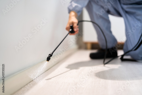 Pest Control Exterminator Man Spraying Pesticide