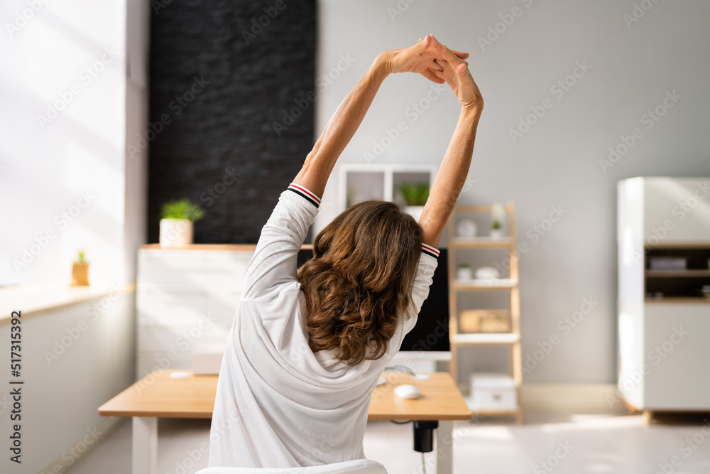 Businesswoman Stretching Her Arms Businesswoman Stretching Her Arms