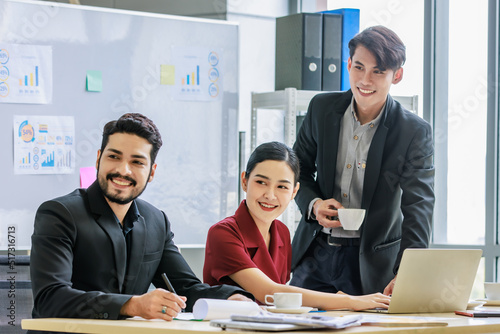 Fotografi Group of millennial Asian Indian multinational multicultural male and female businessman businesswoman teamwork in formal suit sitting smiling brainstorming meeting together in office conference room