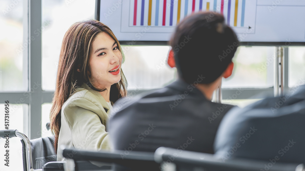 Closeup shot of Asian pretty happy cheerful female businesswoman intern trainee in casual suit sitting smiling f in company office Closeup shot of Asian pretty happy cheerful female businesswoman intern trainee in casual suit sitting smiling f in company office
