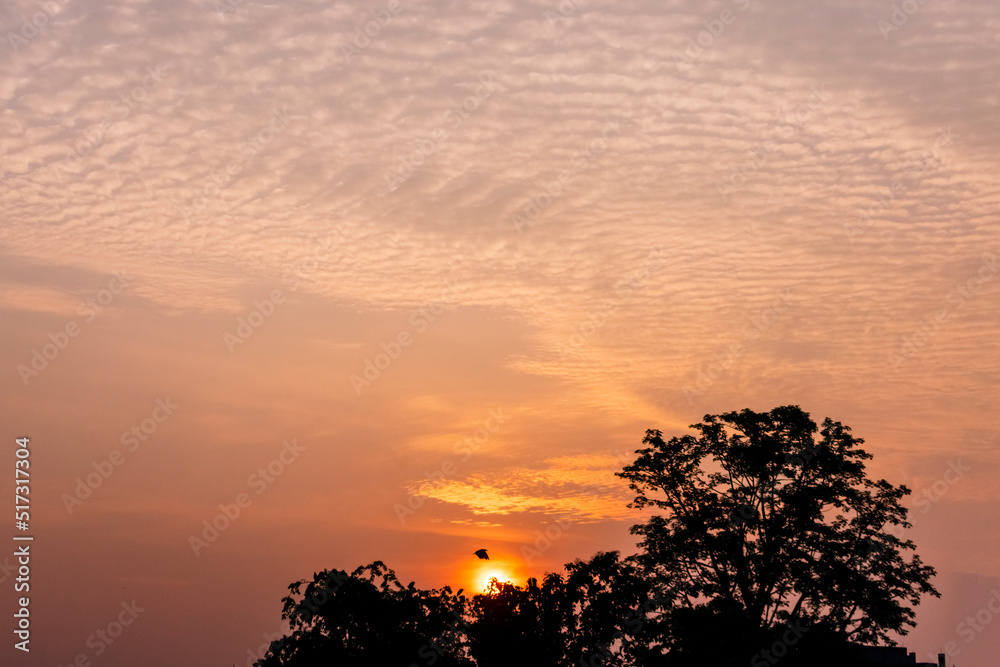 Fototapeta premium Amazing cloud formation in colourful sky during a monsoon sunrise morning