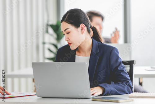 Indian stressed depressed exhausted bearded male businessman sitting at workstation with laptop computer close eyes hold hand on head feeling tired and sleepy after working late overtime last night