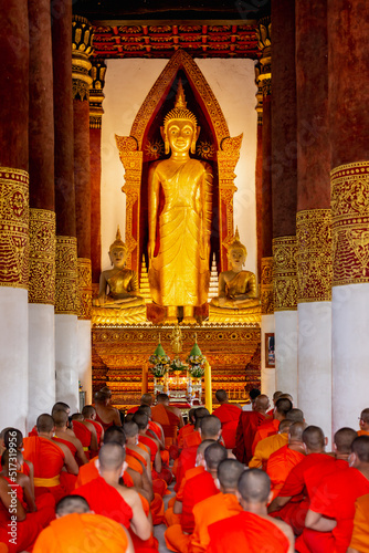 Thai monks sit and pray for religious ceremonies
Wat Boon Yuen Phra Aram Luang, Wiang Sa District, Nan Province photo