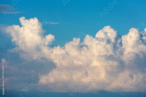 Blue sky background with big white cloud.