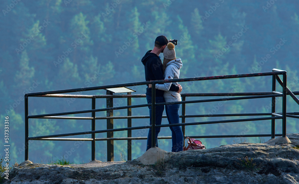 A couple taking selfie in Bastei rocks, Germany