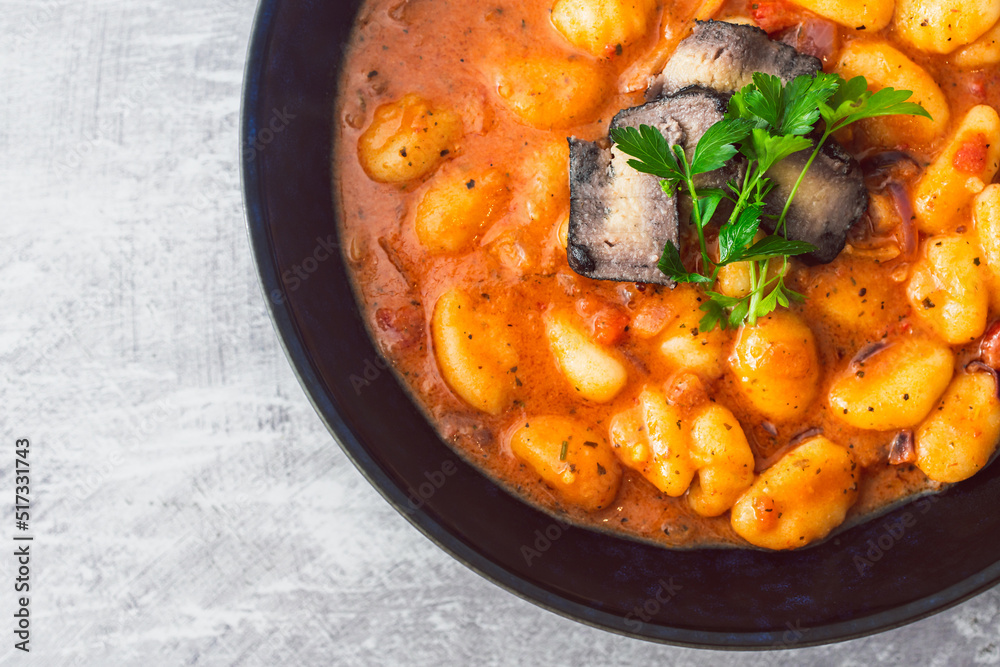 healthy plant-based food, vegan potato gnocchi with bell pepper sauce and ashed cashew cheese healthy plant-based food, vegan potato gnocchi with bell pepper sauce and ashed cashew cheese