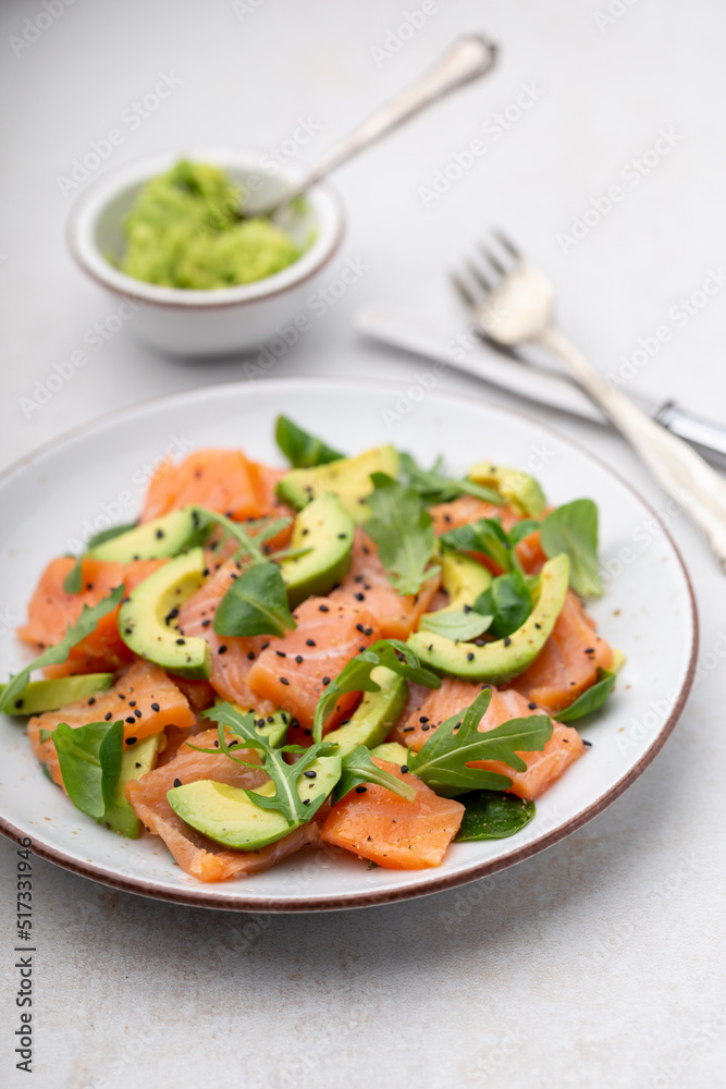 Salmon salad with avocado, for keto and low carb diet. Rusty background, top view, copy space. Salmon salad with avocado, for keto and low carb diet. Rusty background, top view, copy space.