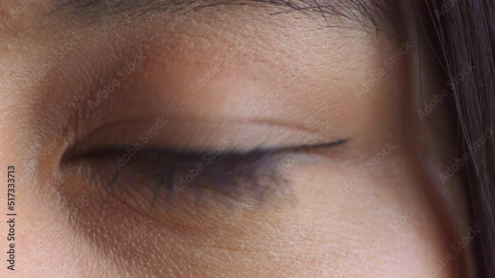 Closeup of a brown eye blinking during a vision test. Anatomy details of a human eyeball checking eyesight during an optometry exam. At the optometrist for prescription glasses or contact lenses Closeup of a brown eye blinking during a vision test. Anatomy details of a human eyeball checking eyesight during an optometry exam. At the optometrist for prescription glasses or contact lenses