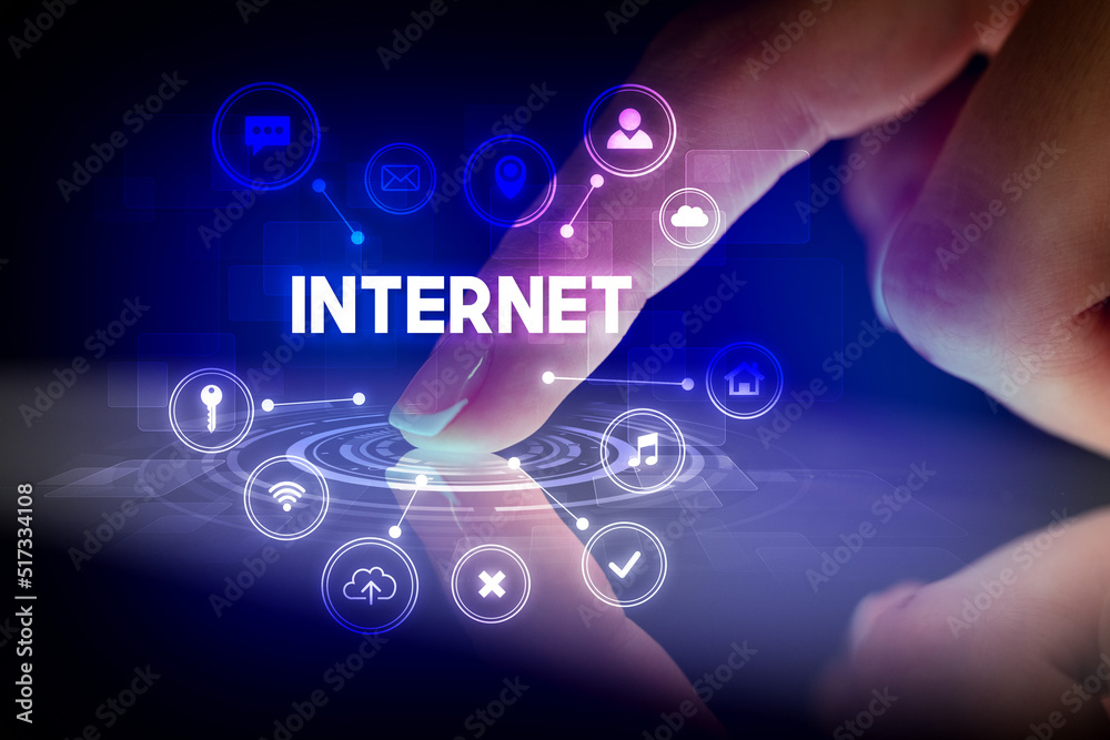 Finger touching tablet with web technology icons concept Finger touching tablet with web technology icons concept