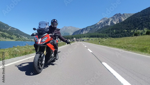 Driving a Motorcycle through the mountains in Austria. © Elco