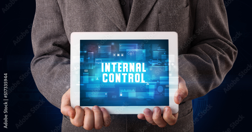 Person holding tablet, security concept Person holding tablet, security concept