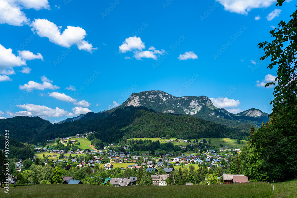 Beautiful idyllic panorama view of village near Altaussee with the peak Sarstein in background on a sunny summer day with blue sky cloud, Salzkammergut-Ausseerland region, Styria, Austria