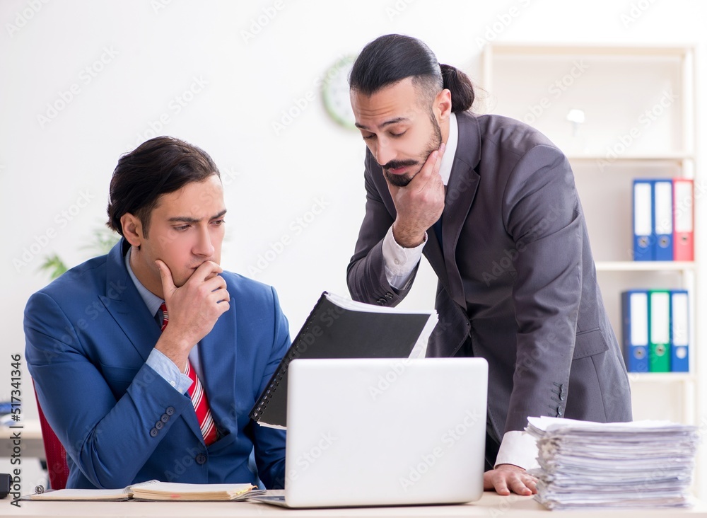 Two male colleagues in the office