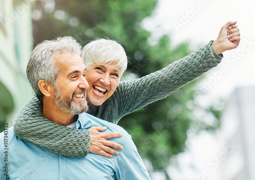 woman man outdoor senior couple happy lifestyle retirement together smiling love piggyback active mature
