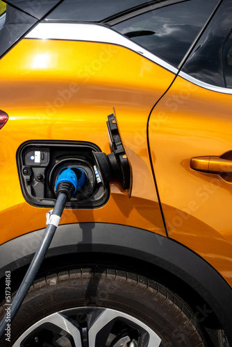 Close up for the socket of the electric car during charging. Modern electro mobility in everyday use. © Fotoforce