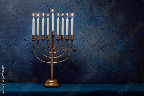 Jewish Hanukkah Menorah 9 Branch Candlestick. Holiday Candle Holder. Nine-arm candlestick. Traditional Hebrew Festival of Lights candelabra. Background for design with copy space photo
