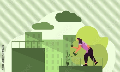 A Woman Watering Plants on The Top of Building
