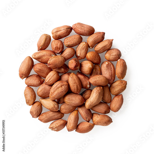 Heap of raw peeled peanuts isolated on a white background. Pile of organic groundnut or monkey nut cutout. Arachis hypogaea as edible seeds and oil crop concepts. Vegetarian snack.