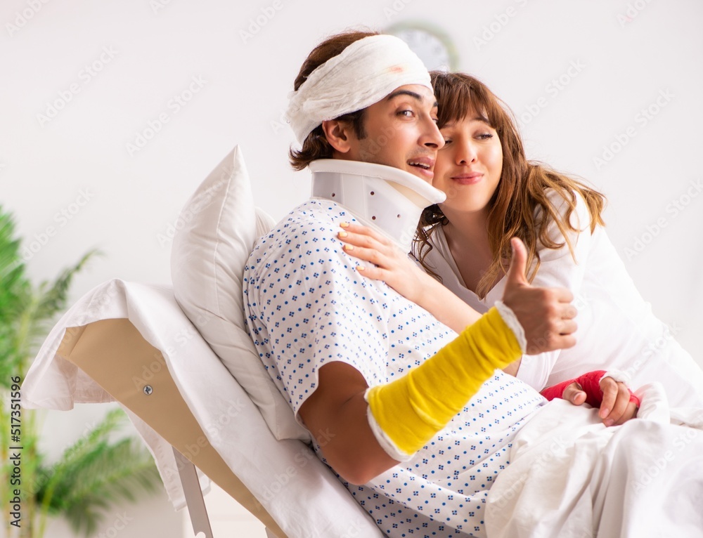 Loving wife looking after injured husband Stock-Foto | Adobe Stock