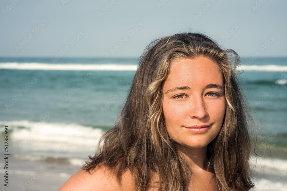 Beautiful young woman walking alone on the beautiful beaches of southwestern France